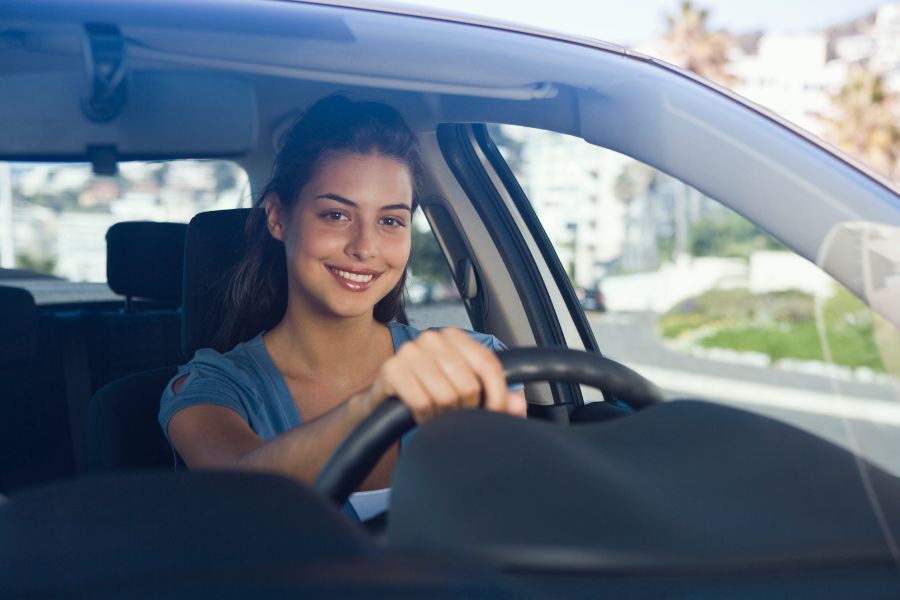woman driving hybrid car