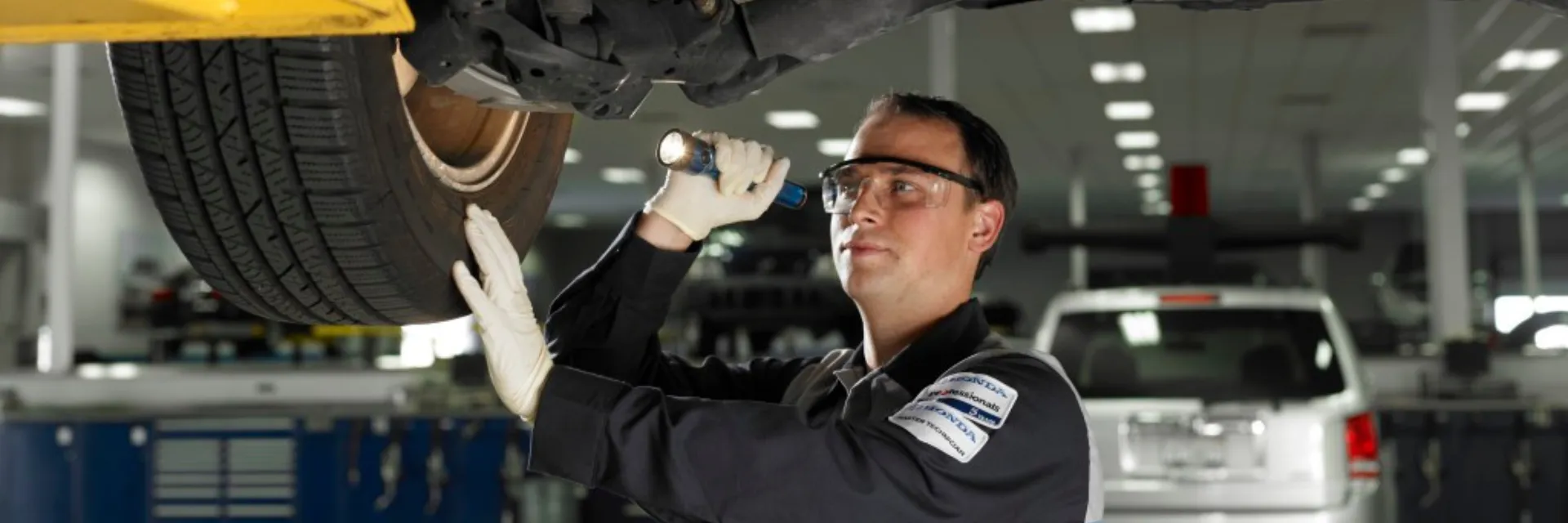 Honda-certified technician inspecting vehicle